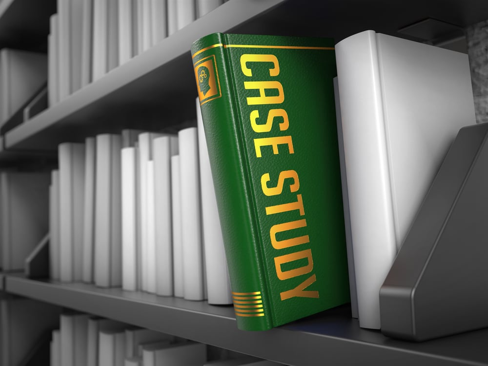 Case Study - Green Book on the Black Bookshelf between white ones.