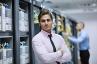 group of young business people it engineer in network server room solving problems and give help and support